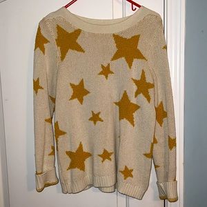 Ivory colored sweater with mustard yellow stars; size small; like new